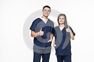 young friendly medical team in lab coat with thumbs up