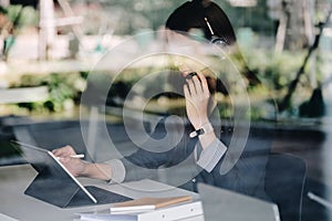 Young friendly operator woman agent with headsets working