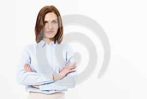 Young friendly successful brunette woman with crossed arms posing on a white background. Business woman with beautiful features