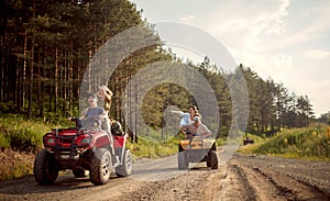 Young friends driving a off road buggy car