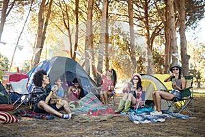 Young friends enjoying together at campsite