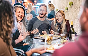 Young friends having fun drinking white wine at street food festival - Happy people eating local plates at open air restaurant