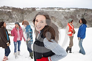 Young Friends Having Fun In Snow