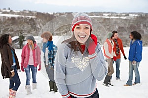 Young Friends Having Fun In Snow