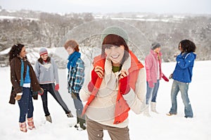 Young Friends Having Fun In Snowy Landscape