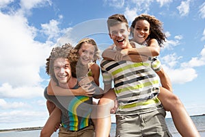 Young Friends Having Fun On Summer Beach