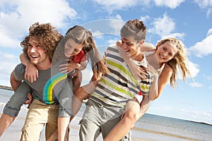 Young Friends Having Fun On Summer Beach