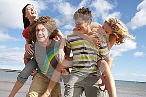 Young Friends Having Fun On Summer Beach