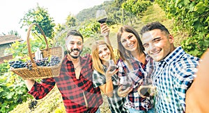 Young friends having fun taking selfie at winery vineyard outdoor - Friendship concept on happy people enjoying harvest together