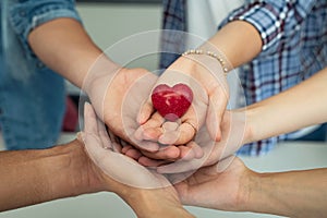 Young friends holding heart stone