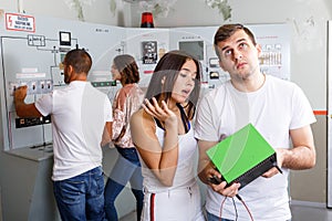 Young friends inspecting battery charger