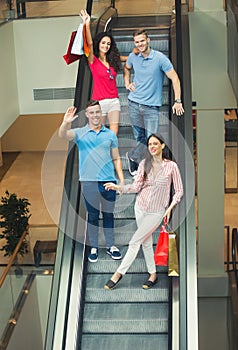 Young friends shopping in mall together