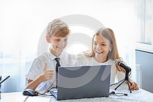 Young friends streaming live on social media sharing creative educational content online