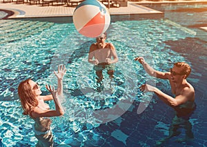 Young friends in swimming pool