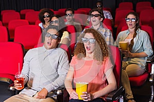 Young friends watching a 3d film