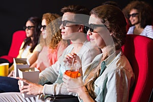 Young friends watching a 3d film