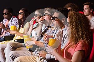 Young friends watching a 3d film