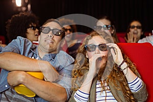 Young friends watching a 3d film