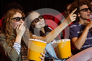 Young friends watching a 3d film