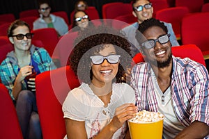 Young friends watching a 3d film