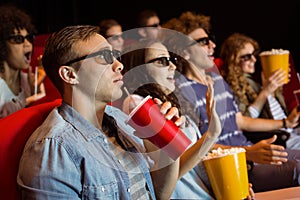 Young friends watching a 3d film