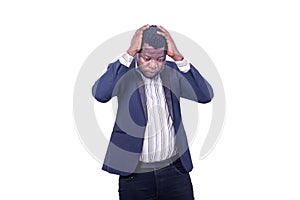 Young frustrated businessman holding his hand on his head