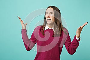 Young fun sad upset perplexed disturb brunette woman girl in red casual clothes posing isolated on blue wall background