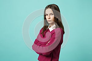 Young fun sad upset perplexed disturb brunette woman girl in red casual clothes posing isolated on blue wall background