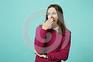 Young fun sad upset perplexed disturb brunette woman girl in red casual clothes posing isolated on blue wall background