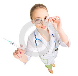Young funny doctor with syringe isolated