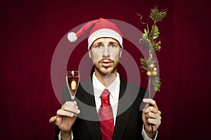 Young funny guy with christmas hat