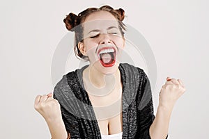 Young funny hipster woman showing tongue, shouting and surprise with funny emotion face.