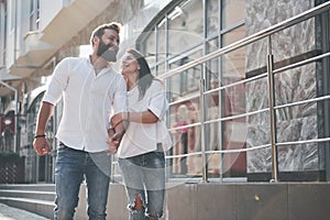 A young funny loving couple have fun on a sunny day.