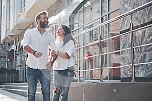 A young funny loving couple have fun on a sunny day.