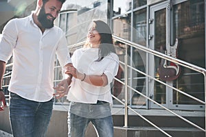 A young funny loving couple have fun on a sunny day.