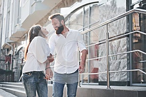 A young funny loving couple have fun on a sunny day.