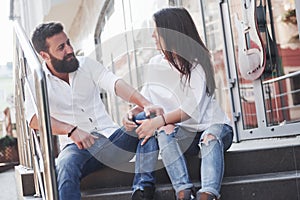 A young funny loving couple have fun on a sunny day.