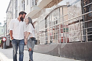 A young funny loving couple have fun on a sunny day.