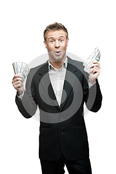 Young funny screaming businessman holding money