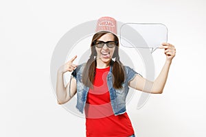 Young funny woman in 3d glasses with bucket for popcorn on head watching movie film, poiting index finger on say cloud
