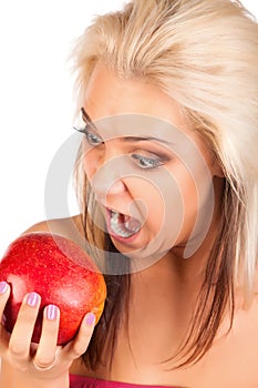Young funny woman with apple in hand