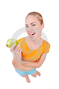 Young funny woman eat green apple