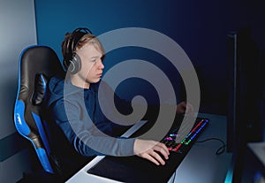 Young gamer playing online video games. Youth people addicted to new technology game