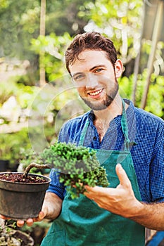 Young gardener with bonsai