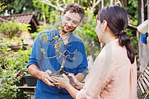 Young gardeners with bonsai