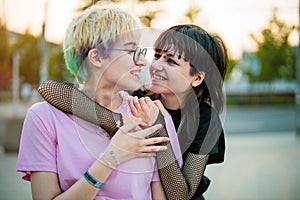 Young gender fluid couple hugging