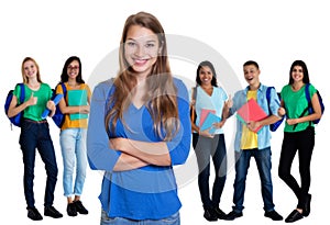 Young german female student with blond hair and group of students