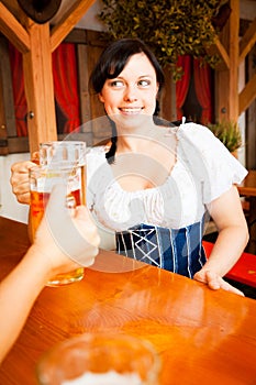 Young German Woman Enjoying A Mug Of Beer