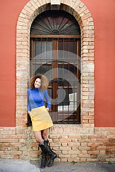 Young girl with afro hairstyle in urban background