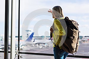 Young girl in airport ready for new adventures